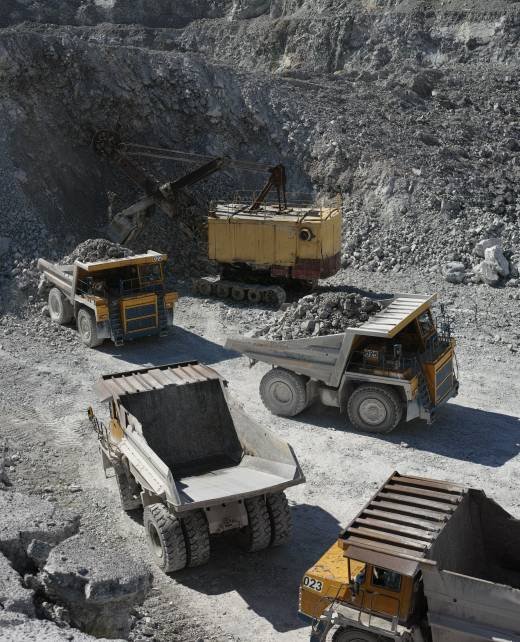 several-dump-trucks-are-queuing-at-an-excavator-to-2026-01-11-09-09-37-utc
